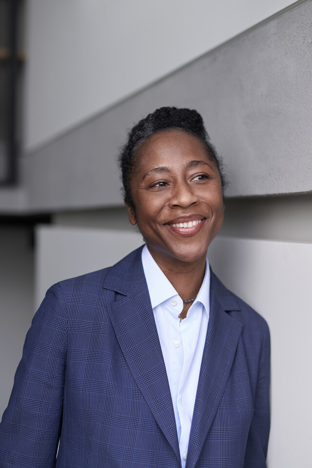 Naomi Beckwith, artistic director of the documenta 16 is seen in a blue blazer and smiling